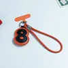 Novo Strap de Celular Pingente Digital de Couro da Huayang, Chaveiro Criativo Personalizado para Bolsa, Acessório Fofo