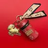 Ovelha do Ano da Sorte em Folha de Ouro 999 com Pingente de Bolsa de Couro Dourado, Decoração de Bolsa, Presente para Evento de Reunião Anual da Empresa