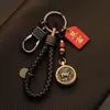 Llavero para coche Bao Shi para hombre y mujer latón 12 signos del zodíaco llavero colgante hecho a mano retro creativo mano de dinero para hombre