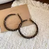 Pendientes redondos con estampado de leopardo flocado vintage, un diseño lujoso y sofisticado, pendientes de moda y únicos para mujer