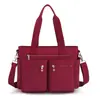 Nova bolsa feminina 2023 casual simples moda portátil bolsa de ombro multifuncional grande capacidade cor sólida fresca bolsa de compras