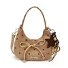 Bolso de mano de lunares con nuevo diseño Yuezhi, principios de otoño 2026, elegante y a la moda, con lazo, para ir al trabajo, de hombro y cruzado.