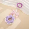 Colgante llavero de lazo bañado fresco y versátil, accesorio para bolso de flor de perla tejida a mano inspirado en la dopamina