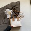 Bolso de mano de textura de alta gama de nueva moda 2025 para mujer, bolso de hombro tipo cubo con bandolera, bolso popular de comercio exterior de este año