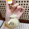 Shuibei Oro Puro 999 Oro Prosperidad Bolsa de la Suerte Llavero Colgante Decoración de Bolsa Regalo para el Cumpleaños de la Novia