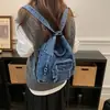 Bolsa de mezclilla casual de gran capacidad para mujer, nuevo modelo 2026, mochila para la ciudad, bolso de hombro y cruzado multiusos, moderno