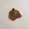 Bonitos y adorables gorros de otoño e invierno para niños, con diseño de poner, material de punto y una serie de dibujos animados, que brindan abrigo y protección para los oídos para bebés y niños pequeños.