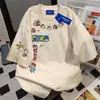 Camiseta Feminina Tendência 2025 com Estampa de Desenho Animado Europeu e Americano, Gola Redonda, Manga Curta, Marca, Verão 2025, Casual, Solta, Estilo Casal