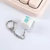 Dispositivo de eixo de teste mérito mais uma chave chave luminosa chaveiro pingente tampa de chave eletrônica botão de descompressão brincar