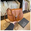 Bolso pequeño vintage 2026 nueva moda bolso de hombro de alta gama para debajo del brazo elegante versátil bandolera tipo silla de montar