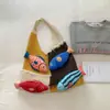 Bolsa de punto de gran capacidad para ir al trabajo transfronterizo para mujer 2026 Nuevo estilo étnico Bolso de hombro de nicho tejido a mano