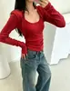 El artículo de moda popular para mujer de este año es el nuevo diseño de otoño 2026, camiseta top básico de manga larga con cuello en U de retazos