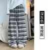 Pantalones anchos de forro polar a rayas negras para mujer de Guang Apparel, nueva colección otoño/invierno 2026, corte relajado, cintura alta, pantalones casuales de pierna recta