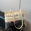 Bolso de mujer nuevo transfronterizo 2026, moderno y a la moda, bolso de hombro o axila texturizado, bolso baguette casual de primavera para el trabajo