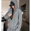 Nueva chaqueta suéter de punto con capucha para mujer, otoño e invierno, con diseño de cremallera, corte holgado, casual y versátil, top casual y relajado