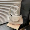 Bolsas populares de nicho de varios años para mujer otoño 2026 nuevo estilo bolso cruzado texturizado bolso de mano bolso de hombro único para debajo del brazo