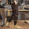Nova coleção Primavera 2026: Calças cargo de alta qualidade, modernas e de corte slim para homens, com modelagem solta, múltiplos bolsos e um design casual preto, adequadas para primavera e outono.