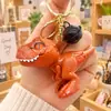 Llavero con forma de tiranosaurio mordedor de una celebridad online, dinosaurio creativo, pequeño colgante para pareja, mochila escolar, pequeño regalo al por mayor