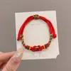 Pulseira de corda colorida zongzi do Festival do Barco-Dragão 2026 novo modelo pulseira trançada artesanal étnica infantil atacado corda vermelha