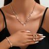 Accesorios de novia sencillos de moda transfronteriza 2024: collar, pendientes, pulsera y anillo de diamantes de imitación dorados.