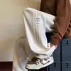 Pantalones de pana modernos estilo americano para hombre, temporada de primavera, pantalones deportivos holgados de pierna recta para adolescentes, pantalones largos versátiles casuales deportivos