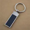Fabricantes de llaveros en stock suministran llavero metálico simple de una sola marca para logo
