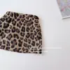 2025 Nova Saia Sexy Versátil Estilo Garota Popular Estampa de Leopardo para Mulheres Outono e Inverno Cintura Alta Emagrecedora Saia Evasê Saia Curta