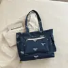 Bolso de Hombro Único con Lazo Otoño 2026 Mezclilla Gran Capacidad Nuevo para el Trabajo Casual Versátil Bolso Tote de Moda