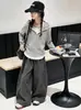 Ropa infantil estilo coreano 2026 colección otoño: conjunto de top a rayas con capucha de dos piezas de imitación y pantalones elegantes de pierna ancha para niñas
