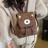 Vento ombro único menina ombro duplo coreano de mão japonês outono veludo desenho animado feminino transversal diagonal camurça 2026 mochila fofa novo estilo