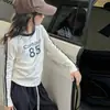 Conjunto de Roupas de Outono para Meninas 2026 Novo Estilo Primavera e Outono para Crianças Camiseta Básica de Manga Longa Meninas Crianças Mais Velhas Calças Esportivas Largas