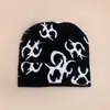 Nuevo patrón gorro de punto estilo europeo y americano de nicho para hombres y mujeres cálido personalidad hip-hop rap gorro pullover para exteriores venta al por mayor