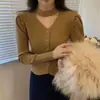 Cardigan de Tricô Chique com Mangas Bufantes Estilo Francês 2026 Feminino Inverno Novo Estilo Versão Coreana Decote Halter em V Design Sutil Top Estilo ins