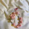 Cadena para teléfono móvil al por mayor comercio exterior transfronterizo caliente color sólido corazón cordón con cuentas funda para teléfono móvil DIY cámara CCD llavero