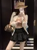 Falda midi de cintura alta para chica atrevida, falda corta esponjosa de verano para mujer, nuevo estilo ballet de deseo puro, ajustada, versátil, anti-exposición