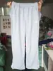 Pantalones de Chándal con Cremallera Bordados Transfronterizos Europeos y Americanos Pantalones Casuales High Street Hip-Hop Rap Street Talla Americana para Hombre y Mujer Venta al por Mayor