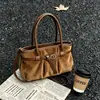 Bolso de mano de gamuza grande y moderno para uso casual, nuevo modelo de principios de otoño 2026, bolso de hombro de alta gama súper popular para ir al trabajo para mujer
