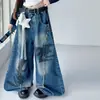 Conjunto de Camiseta Manga Longa Off-the-Shoulder Falso Duas Peças Estilo Coreano para Meninas 2026 Calça Jeans Wide-Leg Longa para Crianças Meninas Médio e Grande