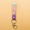 Llavero de accesorios de muñeca linda de cuerda de cuero de caucho suave pvc de arcoíris de deseo creativo accesorios de llavero para bolsa de pareja