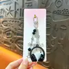 Llavero de bolsa para auriculares de música estilo Miu transfronterizo, correa para teléfono, accesorio para mochila para hombres y mujeres, regalo pequeño al por mayor