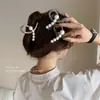 Pinza para el pelo de tiburón pequeño de perla popular en Internet Pinza para el pelo de mujer Pinza para el pelo de la parte posterior de la cabeza Pinza para el pelo semi-recogido Pinza de agarre Pinza de disco para el pelo Tocado