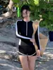Traje de baño deportivo de dos piezas de manga larga para mujer, estilo nuevo 2026, que disimula el abdomen y estiliza, adecuado para playa, vacaciones y aguas termales, disponible para venta al por mayor