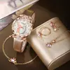 2024 transfronterizo nuevo reloj de pulsera con esfera redonda de pavo real, correa brillante, traje de joyería de garra de gato venta al por mayor