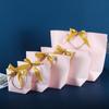 Bolsa lingote de lazo en stock cartón blanco bolsa de mano para regalo de Navidad bolsa de papel para compras de ropa colorida bolsa de embalaje