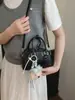 2026 Nuevo Bolso Cubo de Rejilla de Diamantes Retro de Gama Alta para Mujer Moda de Nicho Bolso de Hombro Único Cruzado Bolso de Mano Versátil para el Trabajo