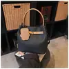Bolso Retro de Nicho para Mujer 2026 Nuevo de Moda Casual Versátil Bolso Cubo para Viajar Simple Cruzado Bolso Madre-Hija