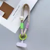 Dopamina Colorido Cordón Corto Correa para Teléfono Correa de Muñeca Tarjeta Colorida Perla Dibujos Animados Lindo de Mano Bloqueo de Color Correa de Moda