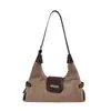 Bolso retro mate de moda para mujer, nueva colección 2026, bolso de hombro versátil para el trabajo, bolso de gamuza de nicho con forma de cuerno