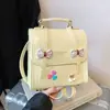 Mochila transfronteiriça estilo coreano com laço para mulheres, novo modelo 2026, simples e elegante, bolsa quadrada pequena de alta aparência, mochila multifuncional