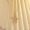 Collar de acero inoxidable más vendido transfronterizo, serie oceánica, diseño de estrella de mar con goteo de aceite, elegante y con estilo, chapado en oro de 18 quilates, collar impermeable para mujer